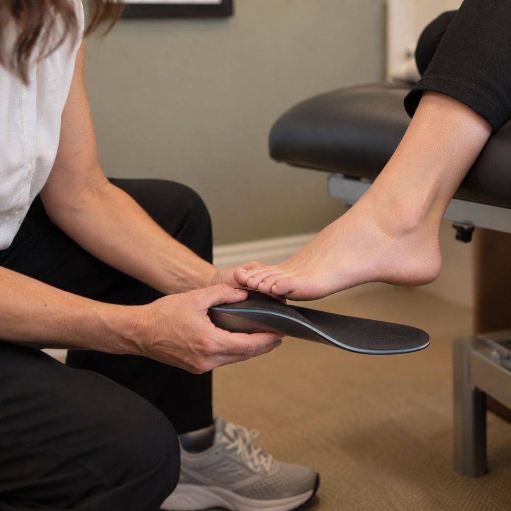 Fitting a custom orthotic to a patient's foot