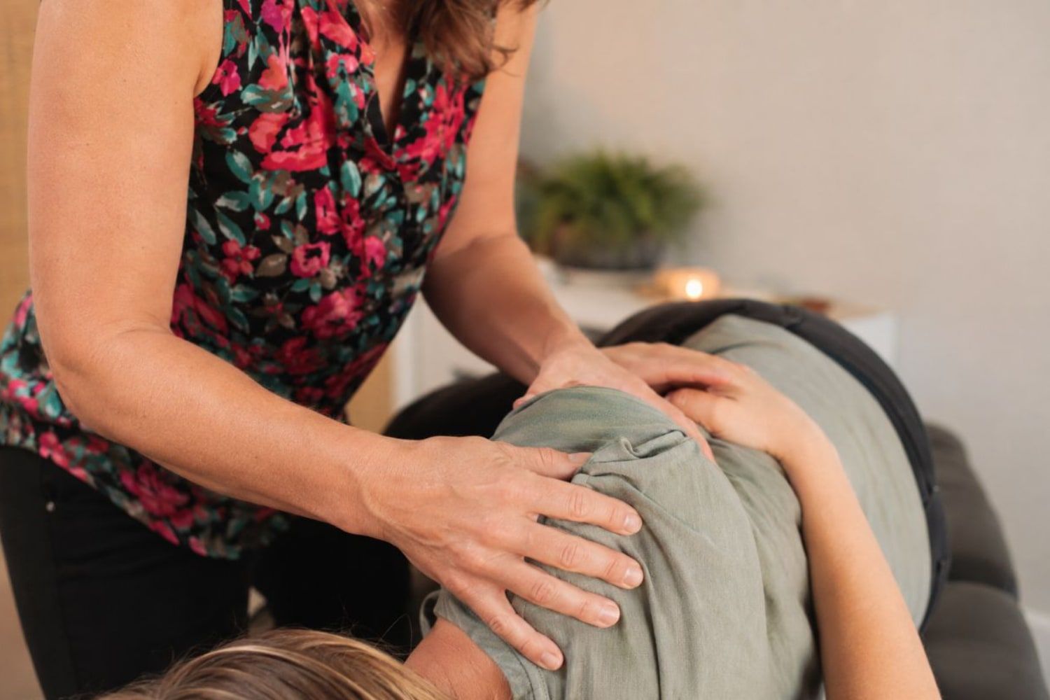 Dr. Amy Young treating a patient's shoulder